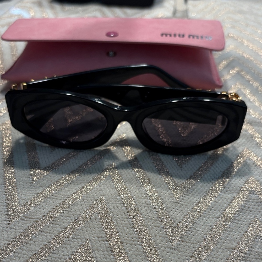 Miu Miu Black Sunglasses with Gold Accents